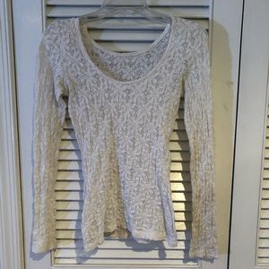 A white long sleeved sheer blouse